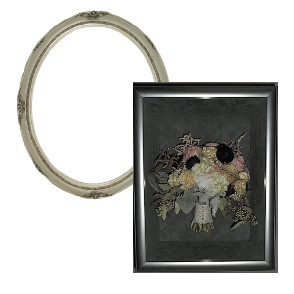 a white oval frame and a preserved flower arrangement in a silver rectangular frame 